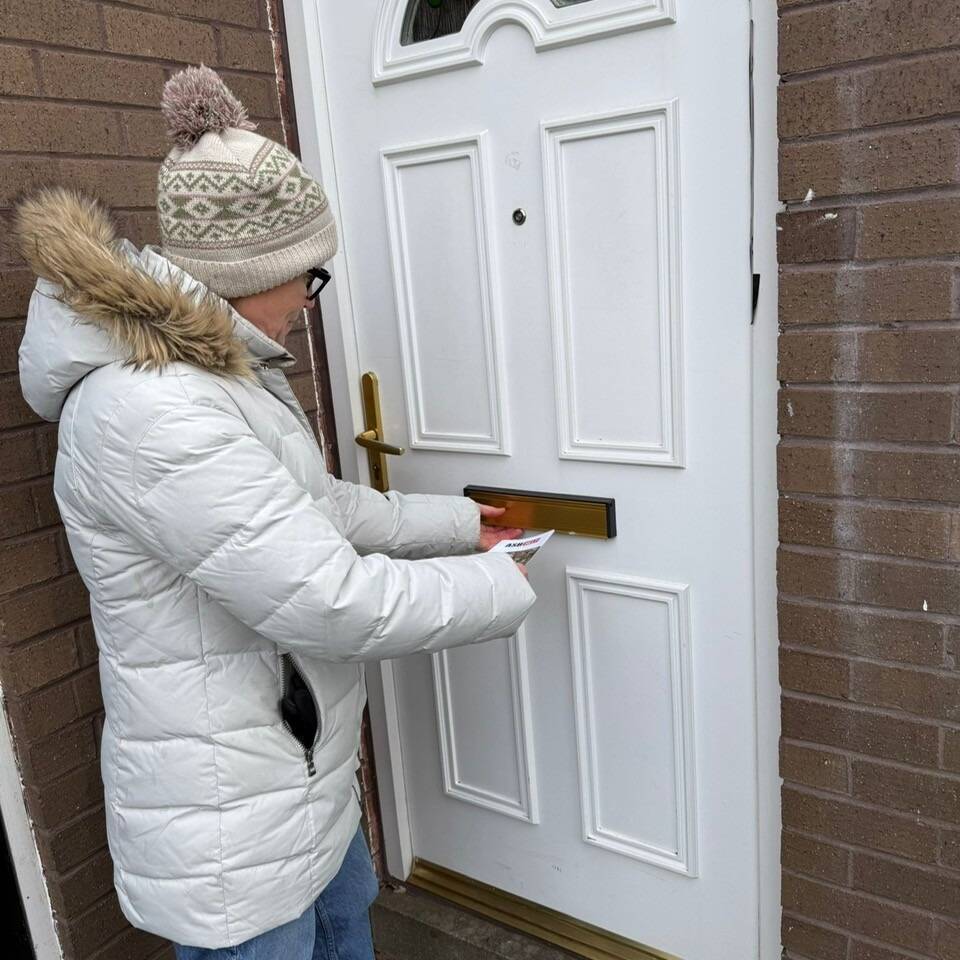 Louise posting leaflets